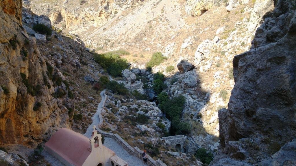Stone steps descending toward the Kourtaliotiko Gorge river corridor