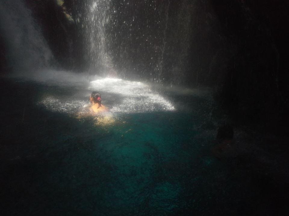 Dark turquoise waterfall pool inside Kourtaliotiko Gorge